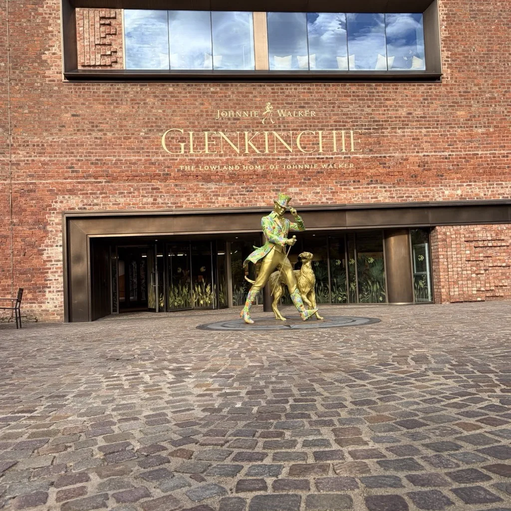 The visitor centre of Glenkinchie Distillery in Pencaitland with a golden statue at the entrance