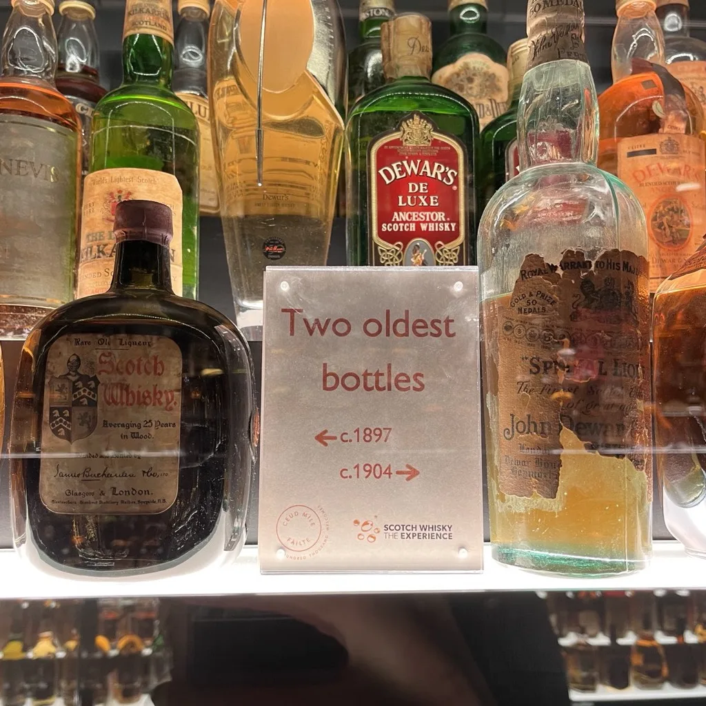A "Two oldest bottles" sign with the oldest bottles in the collection from around 1897 and 1904